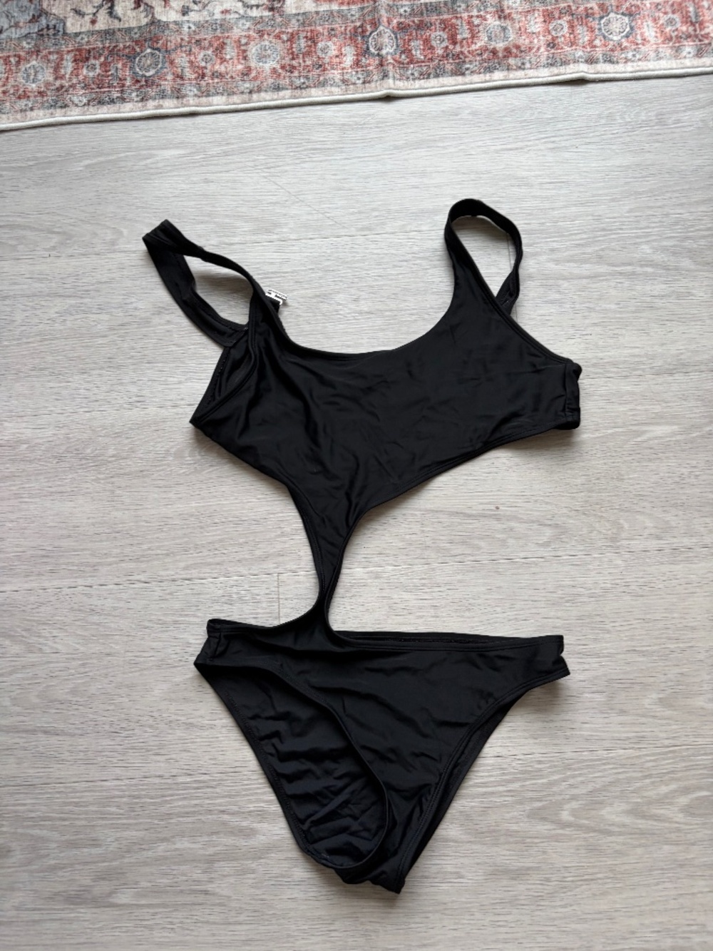 Black asymmetric swimming costume